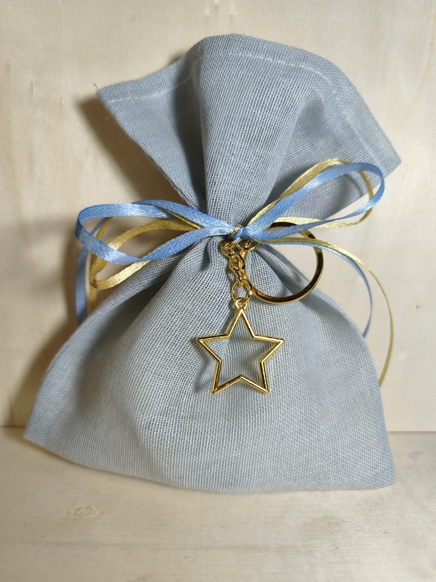 Mπομπονιερα Βαπτισης Πουγκι Γαζα+Αστερακι Μπρελοκ