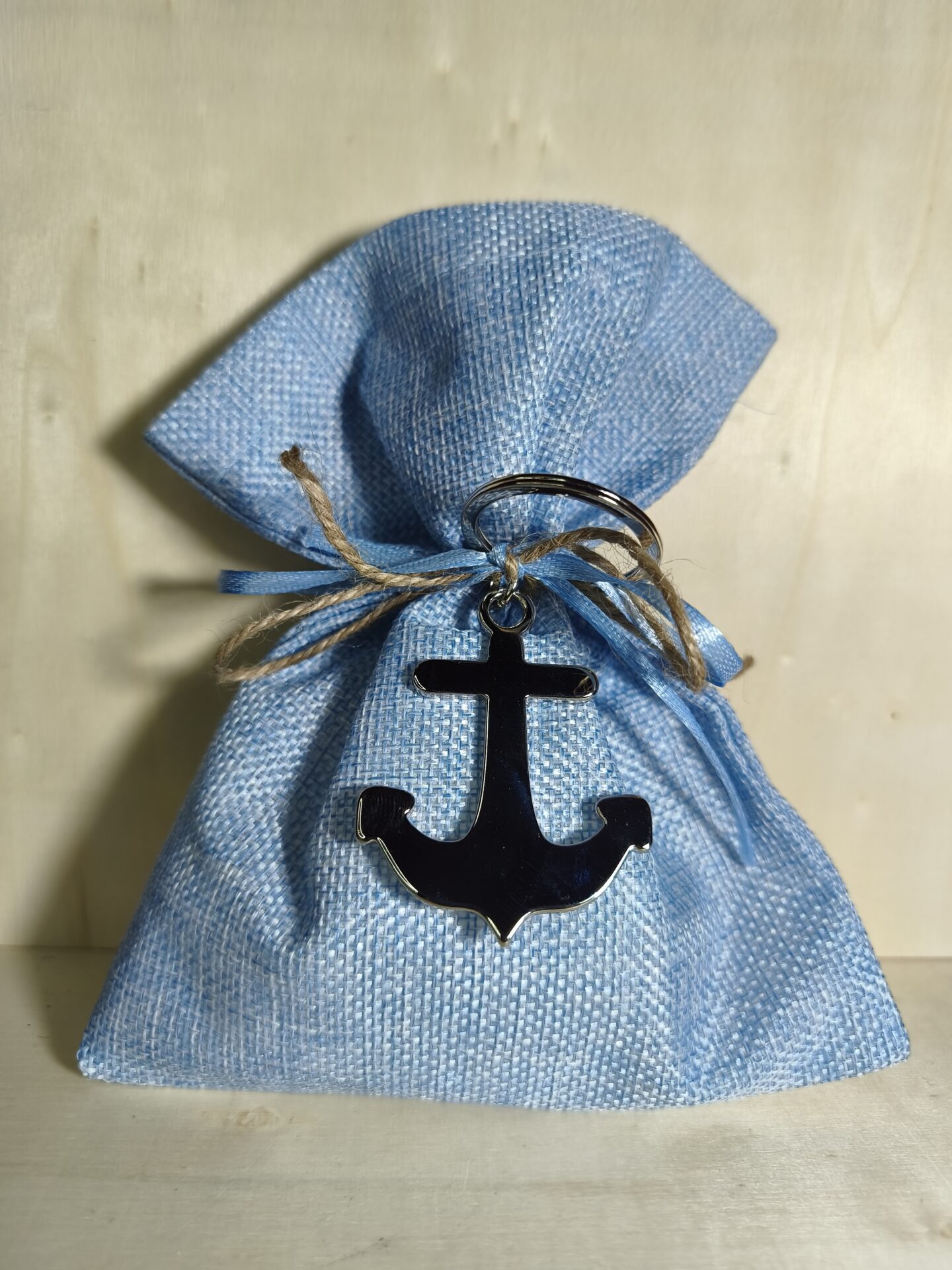 Mπομπονιερα Βαπτισης Πουγκι Καμβας+Αγκυρα Ασημι Μπρελοκ