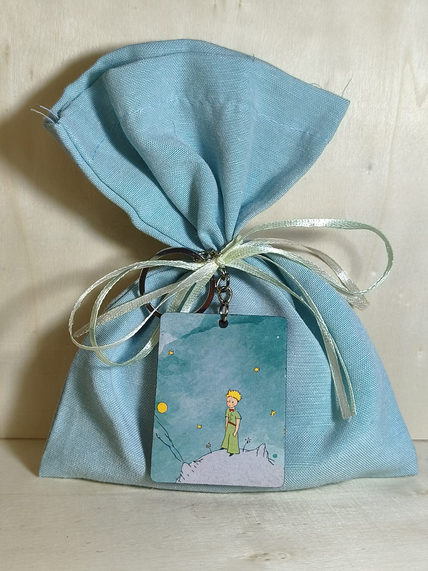 Mπομπονιερα Βαπτισης Πουγκι Βαμβακερο+Μικρος Πριγκιπας Μπρελοκ