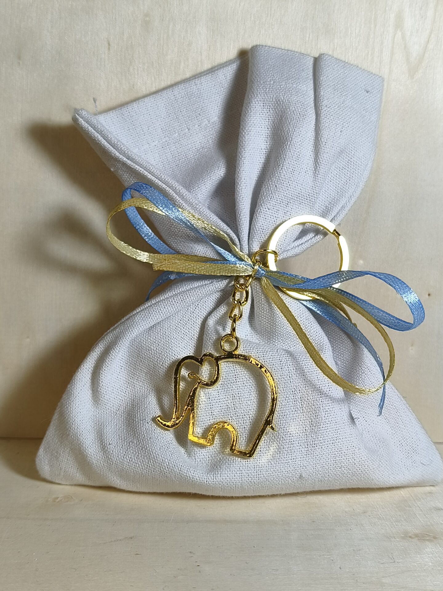 Mπομπονιερα Βαπτισης Πουγκι Λινο+Ελεφαντακι Μπρελοκ